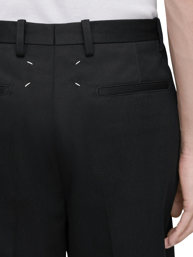 TAILORED BERMUDA SHORTS WITH PLEATS AND FRINGED HEM