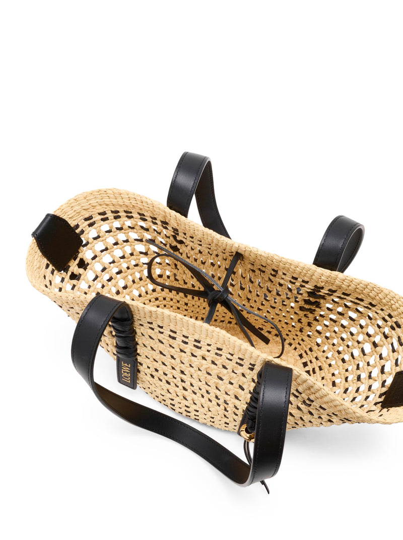 SMALL WOVEN BASKET MADE OF IRACA PALM AND CALFSKIN