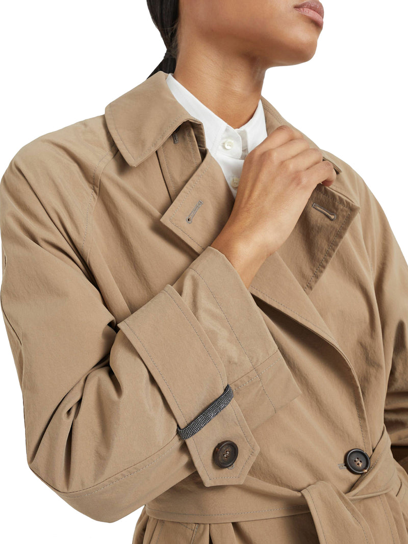 Techno canvas trench coat with shiny details on the cuffs