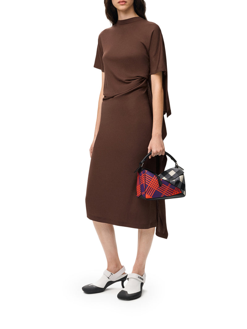 DRESS WITH ASYMMETRIC DRAPED CONSTRUCTION AND CAPE PANEL