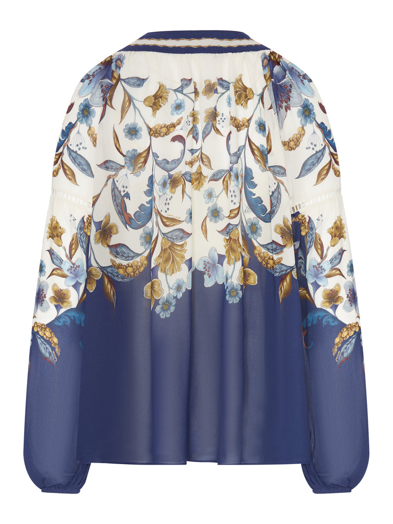 PRINTED BLOUSE WITH A BOW AT THE NECK